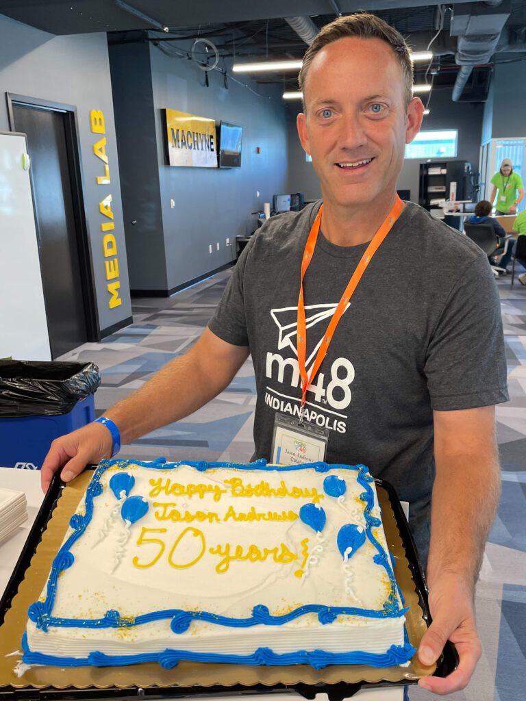 Jason turns 50 and displays his birthday cake.