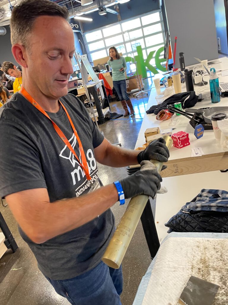 Jason polishes a tube to help out on his birthday.