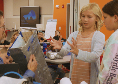 Two fourth grade students explain their approach to building an animal prosthesis for a class project.
