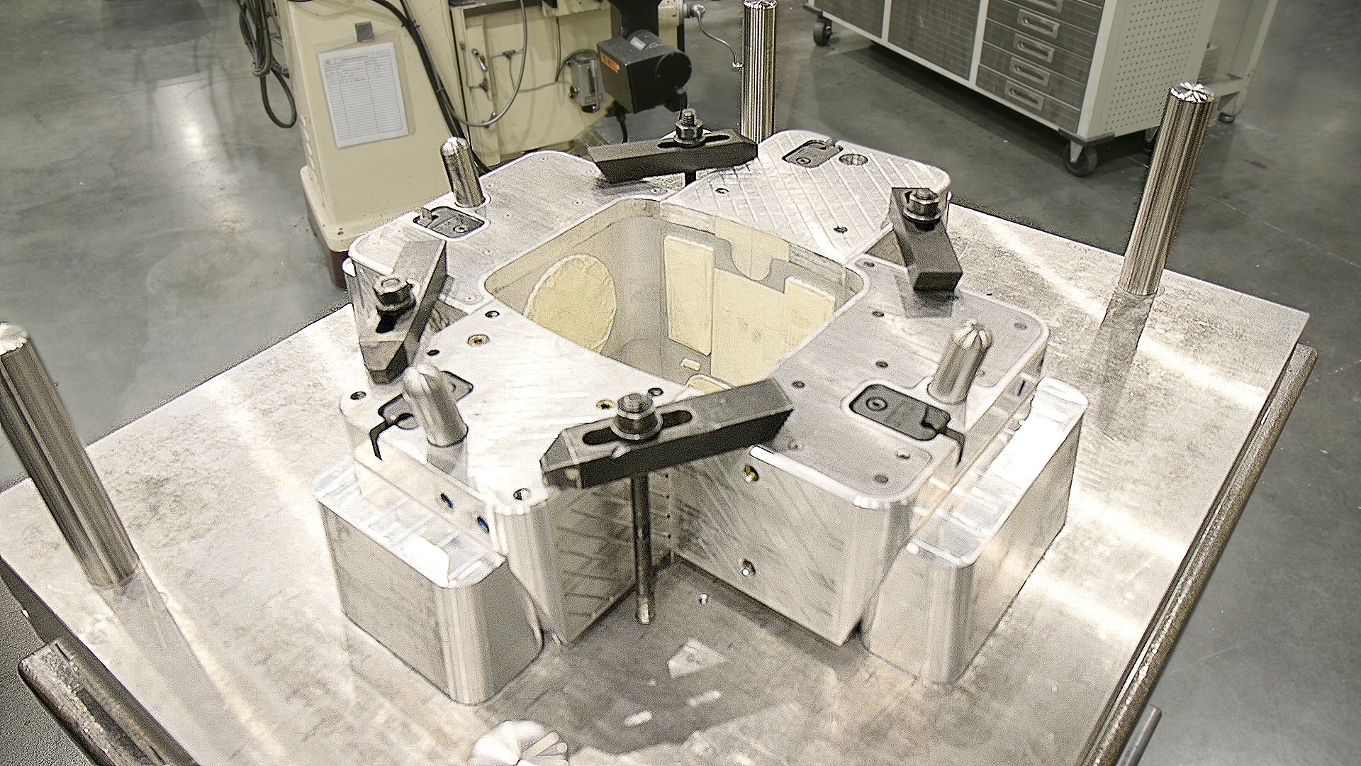 A large plastic injection mold featuring four side actions to accommodate part geometry.