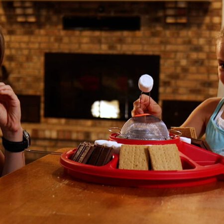 Children make S'mores indoors with a Sterno product.
