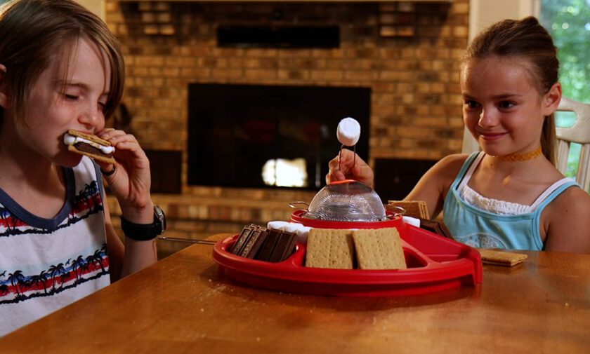 Children make S'mores indoors with a Sterno product.